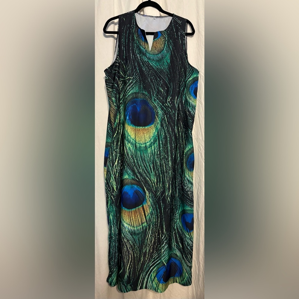 Peacock Print Dress. 23” across.
45 “ down from armpit. Material feels polyester